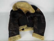 A vintage sheepskin flying jacket.