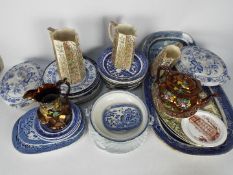 A quantity of ceramics, predominantly blue and white to include meat plates, serving dishes,