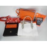 An Ashwood handbag and purse in orange leather,
