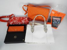 An Ashwood handbag and purse in orange leather,