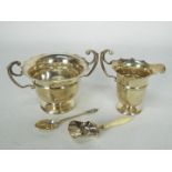 A collection of hallmarked silver to include sugar bowl and cream jug, Birmingham assay 1905,