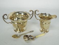 A collection of hallmarked silver to include sugar bowl and cream jug, Birmingham assay 1905,