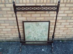 A mahogany and needlework fire screen, approximately 112 cm x 80 cm.