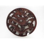 A carved wood 'Dragon' roundel, approximately 49 cm (h).