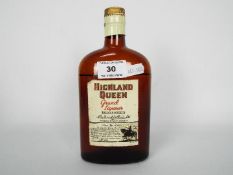 A small, vintage bottle of Highland Queen Grand Liqueur Scotch Whisky,