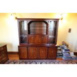 A Beresford & Hicks cabinet, the upper section with twin glazed doors over four cupboards,