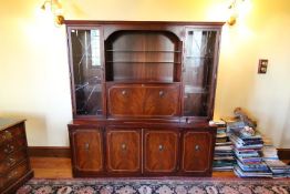 A Beresford & Hicks cabinet, the upper section with twin glazed doors over four cupboards,