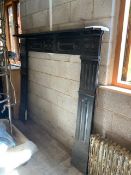 A Victorian cast iron fire surround measuring approximately 164 cm x 188 cm (130 cm between