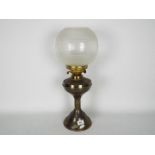 A vintage oil lamp with a height of 56 cm,
