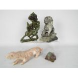 Stone carvings to include Buddhist Lion, Qilin and similar, largest approximately 21 cm (h).