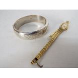 A hallmarked silver hinged bangle and a lady's Everite wristwatch.