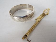 A hallmarked silver hinged bangle and a lady's Everite wristwatch.