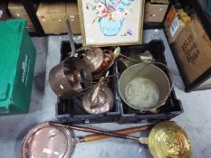 A quantity of copper and brass ware and a framed needlework picture.