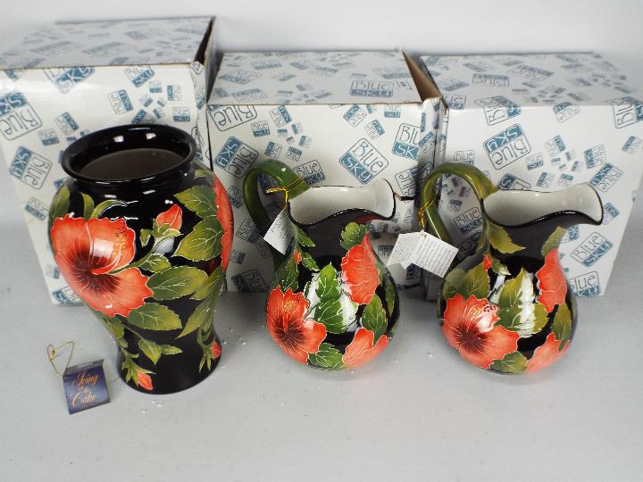 Jeanette Mcall for Blue Sky Pottery - A boxed pair of jugs with tubelined decoration from the Icing