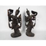 A pair of Asian carved wood figurines depicting ladies holding fans, approximately 36 cm (h).