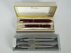 Parker - A vintage Parker Victory fountain pen and pencil set in red, the pen with 14k nib,