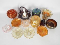 Carnival Glass - A small selection of carnival glass to include a marigold footed rose bowl,