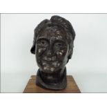 A contemporary bronze bust depicting an elderly lady, signed, approximately 27 cm (h),