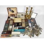 Lot to include stainless and plated flatware, part cased / boxed, brass candlesticks and other.