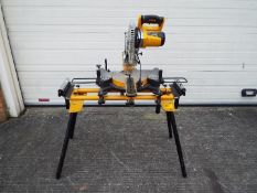 A JCB mitre saw, model MS-254SB and stand.