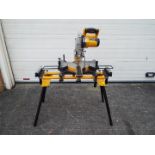 A JCB mitre saw, model MS-254SB and stand.