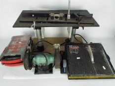 Lot to include a Trend Routerack, a Nu Tool bench grinder, a tile cutter and accessory organisers.