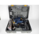 Ryobi - A 230v belt sander, model EBS 1310v, contained in carry case.