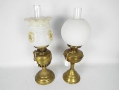 Two brass oil lamps, largest apporximately 50 cm (h).