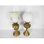 Two brass oil lamps, largest apporximately 50 cm (h).