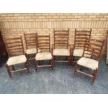 Four ladder back chairs and two carvers.