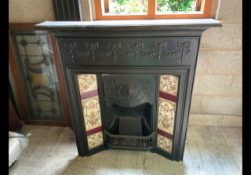 A Victorian cast iron fireplace with tile surround, approximately 177 cm x 104 cm x 16 cm.