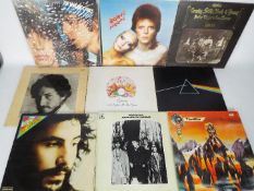 A collection of 12" vinyl records to include Pink Floyd, Queen, Bob Dylan, The Rolling Stones,