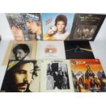 A collection of 12" vinyl records to include Pink Floyd, Queen, Bob Dylan, The Rolling Stones,