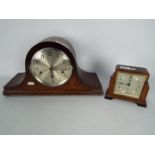 A mantel clock with key and pendulum and a small Art Deco Elliot clock.