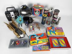 A collection of Batman and Superman themed items to include badges, figurines and other.