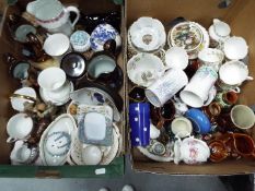 Two boxes of predominantly mixed ceramics to include figurines, tea wares,