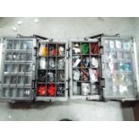 Two accessory organiser boxes, one containing automotive fuses,