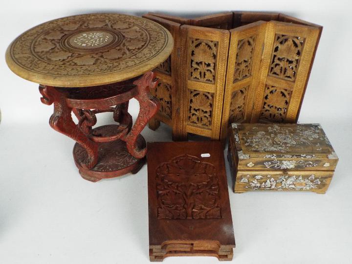 A folding table with carved decoration, 41 cm (h), a cinnabar lacquer style stand,