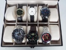 A 10 division watch box with six watches to include Sekonda, Accurist, Shark and other.