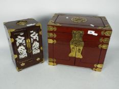 Two wood and brass mounted table top jewellery cabinets,