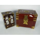 Two wood and brass mounted table top jewellery cabinets,