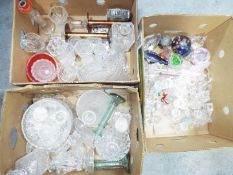 Mixed glassware to include paperweights, vases, bowls, candlesticks and similar, three boxes.