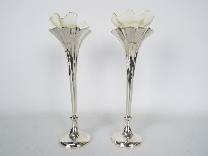 A pair of Victorian silver specimen vases (weighted bases), London assay 1897,