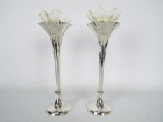 A pair of Victorian silver specimen vases (weighted bases), London assay 1897,