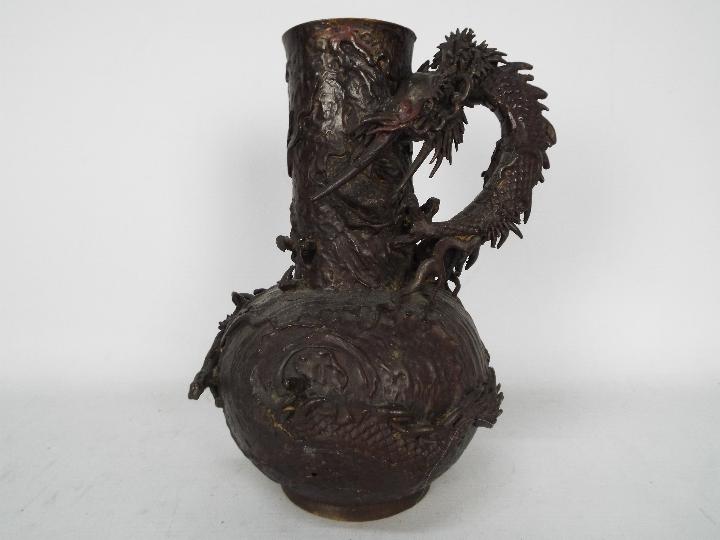 Bronze vase with applied dragon, signed to the base, approximately 25 cm (h).