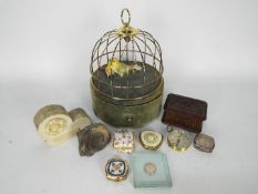 A mixed lot to include a vintage musical bird cage jewellery box, ammonite fossil, trinket box,