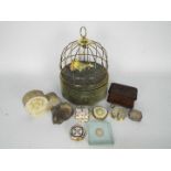 A mixed lot to include a vintage musical bird cage jewellery box, ammonite fossil, trinket box,