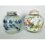 Two Chinese lidded pots, one decorated with with a landscape scene in blue and white,