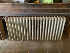 A Victorian, four bar, cast iron radiator,