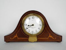 A mahogany cased, 8 day, mantel clock with inlaid decoration, retailed by R McDowell & Co Ltd,